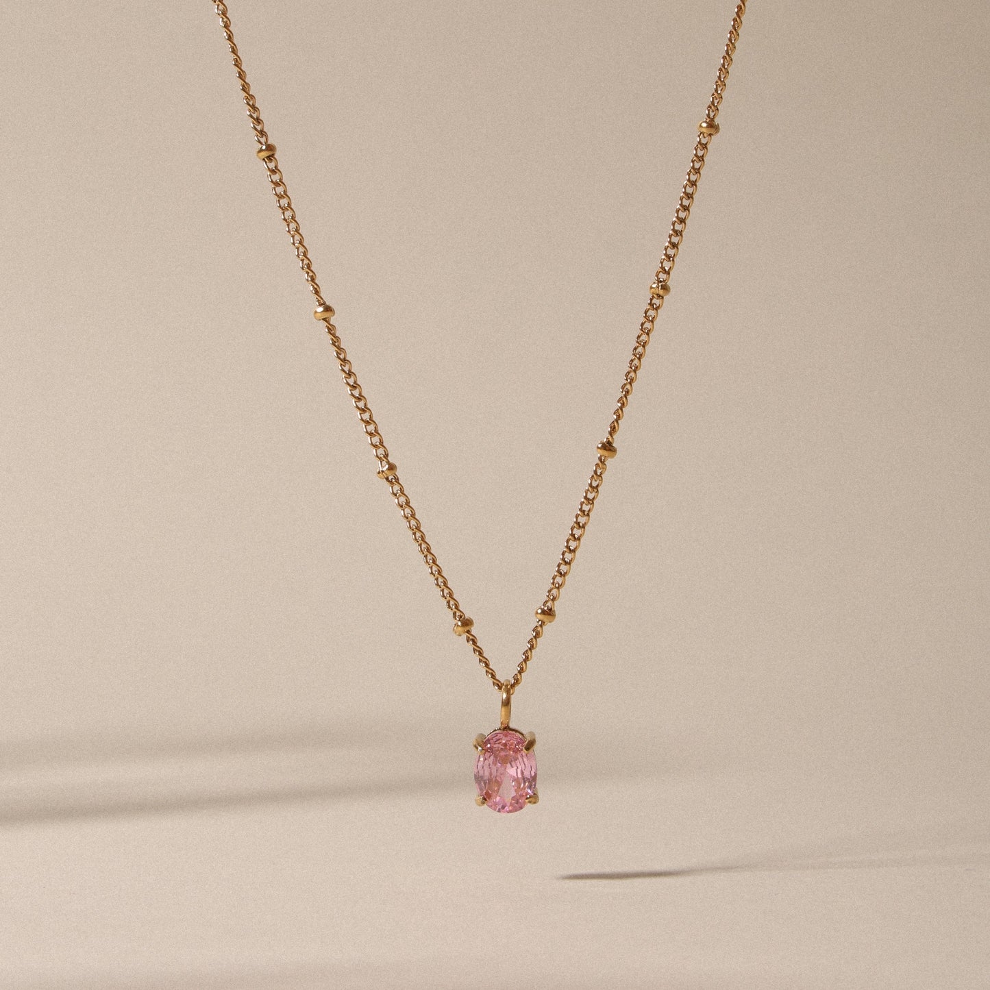 Damen Halskette goldfarben mit rosa CZ Anhänger aus Edelstahl
