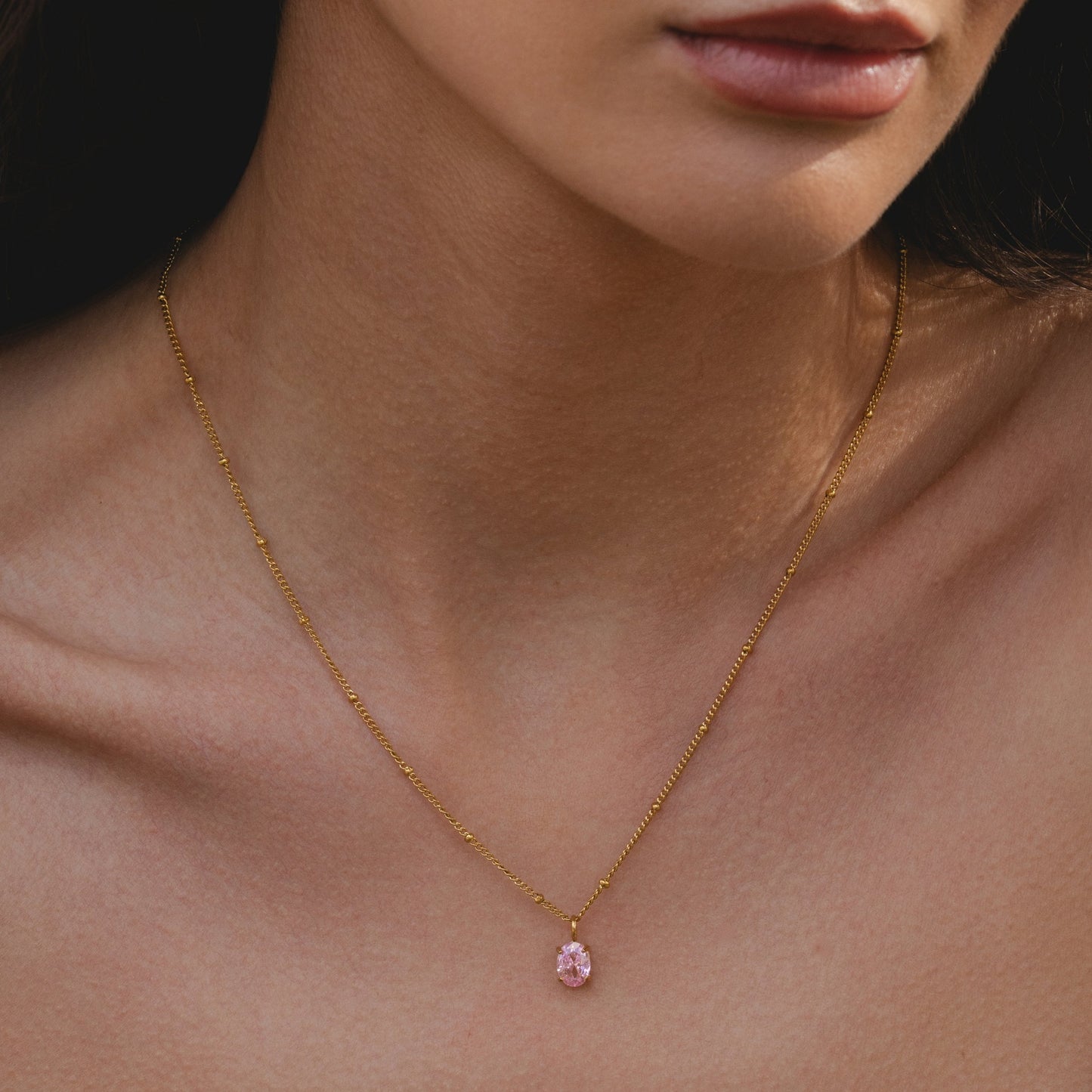Damen Halskette goldfarben mit rosa CZ Anhänger aus Edelstahl